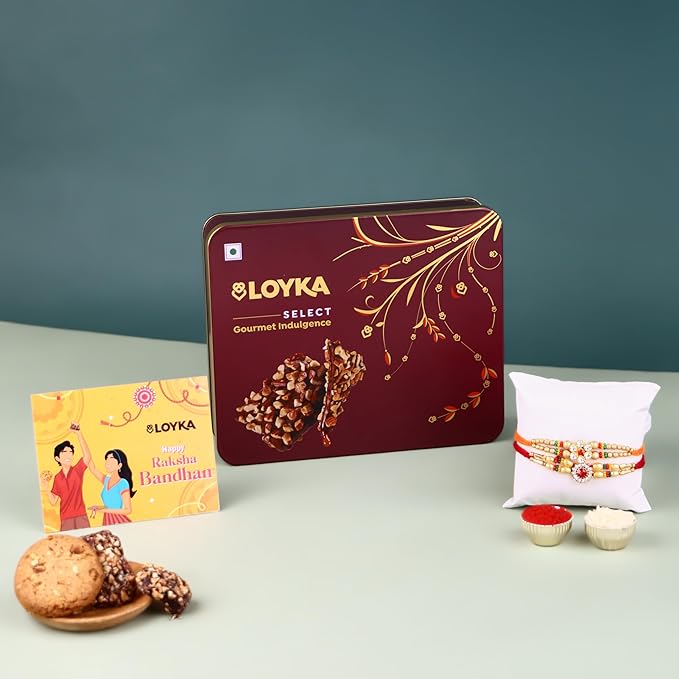 Loyka Select Majestic Maroon Tin (Reusable) With 2 Rakhi, Roli, Chawal, Card – 3 Almond Brittle Gold, 3 Brownie, 4 Pops, 2 Almond Cookies – A Premium Treat Box for Gifting & Indulgence (Assorted Rakhi)