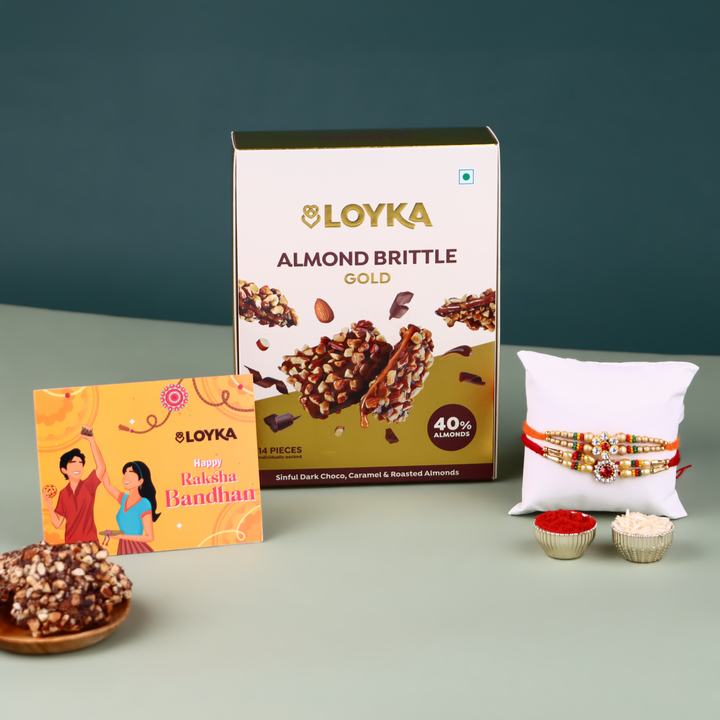 LOYKA Almond Brittle Gold Choco Box 14 Pcs with 2 Rakhi, Roli, Chawal & Card | |Choco & Nut Dryfruit Delicacy | Roasted California Almonds (40%),Premium Chocolate Gift HamperDark Choco,Salted Caramel,Any-Time Snack (Assorted Rakhi)